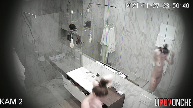 A pretty naked girl with an sporty body is thoroughly washing her hairy pussy