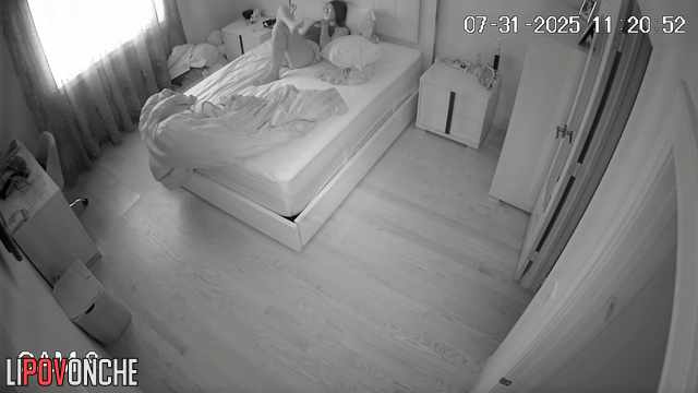 A sexy student is masturbating vigorously, pulling aside her short shorts