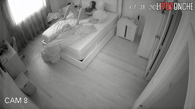 A sexy student is masturbating vigorously, pulling aside her short shorts