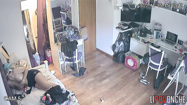 A sweet girl walks into her bedroom wearing nothing but panties
