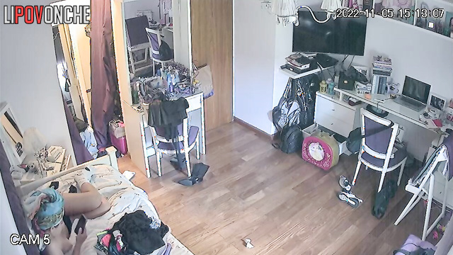A sweet girl walks into her bedroom wearing nothing but panties