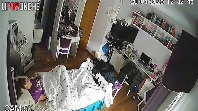 A bored, pretty girl plays with her clitoris while hiding under a blanket