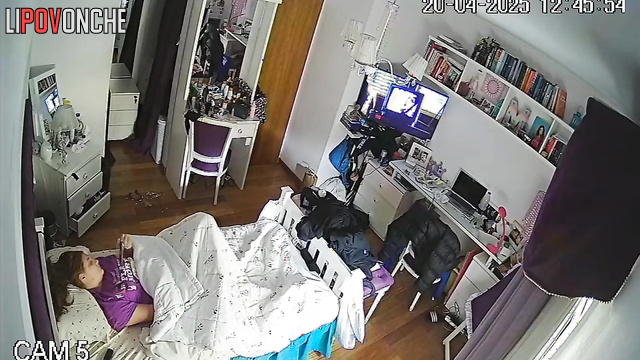 A bored, pretty girl plays with her clitoris while hiding under a blanket