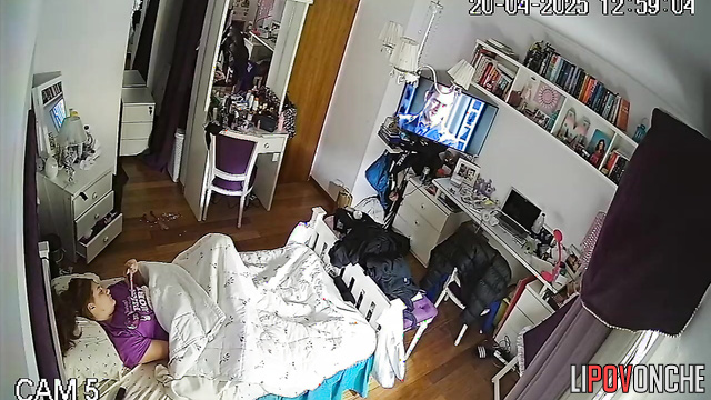 A bored, pretty girl plays with her clitoris while hiding under a blanket