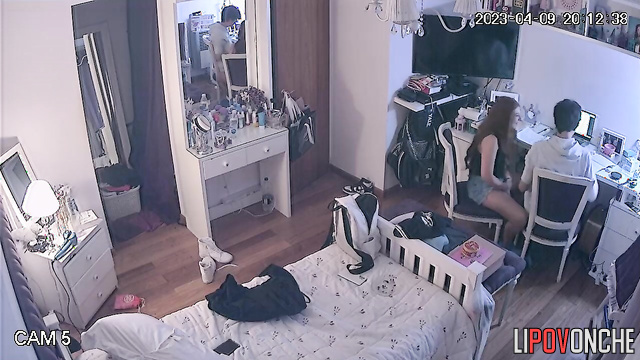 Teens enjoying each other (boy gently stroked her hair)
