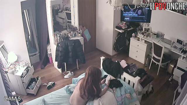 The bored redhead takes off her uncomfortable bra, baring her sexy breasts