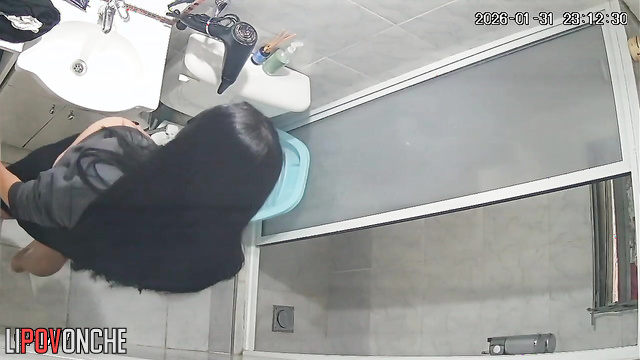 A long-haired, pregnant brunette thoroughly washes her hot pussy in the shower