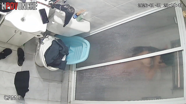 A long-haired, pregnant brunette thoroughly washes her hot pussy in the shower
