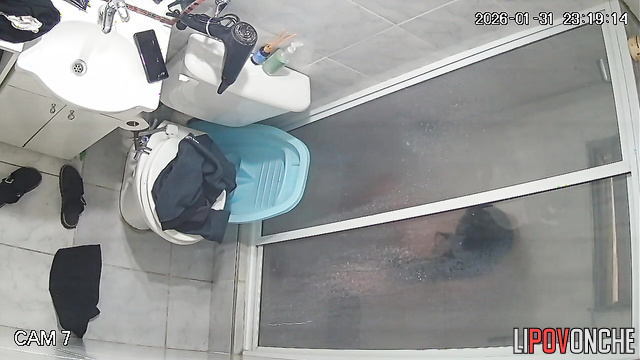 A long-haired, pregnant brunette thoroughly washes her hot pussy in the shower