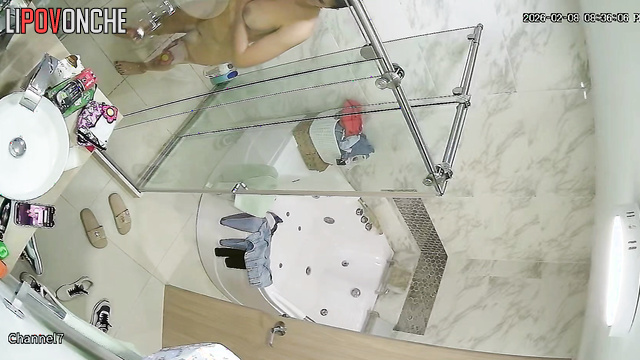 A hidden camera in the shower captured the stunning body of a young brunette