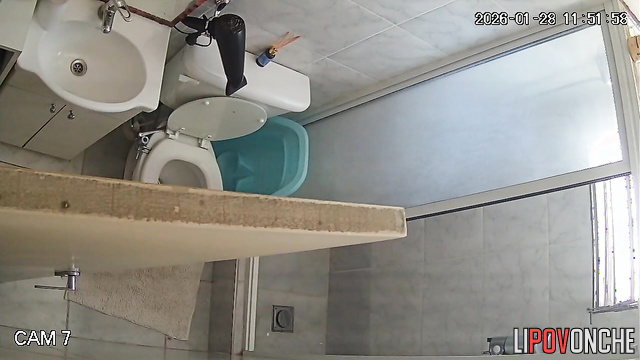 A pregnant brunette pulls down her sexy shorts, sitting down on the toilet