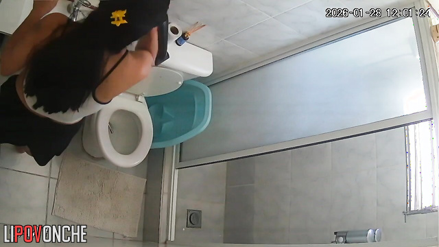 A pregnant brunette pulls down her sexy shorts, sitting down on the toilet