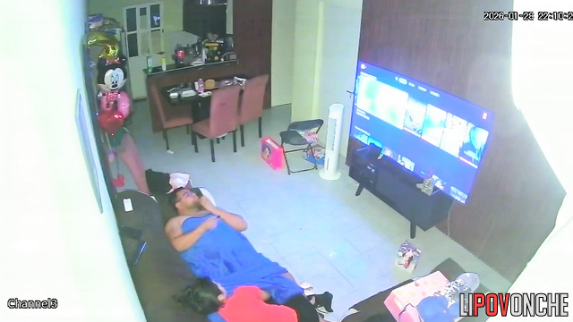A horny mom plays with her bored husband's big cock while watching TV