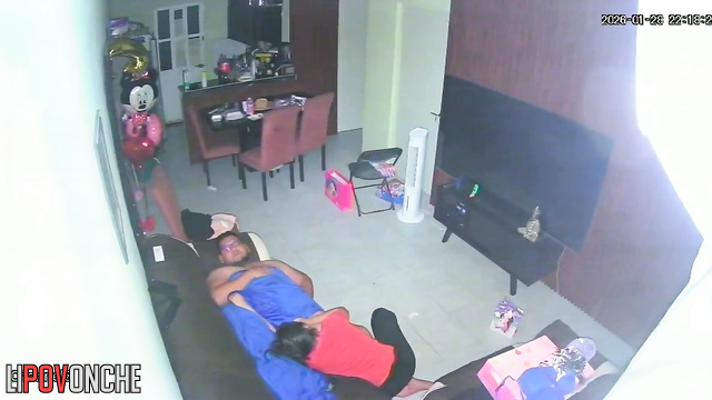 A horny mom plays with her bored husband's big cock while watching TV