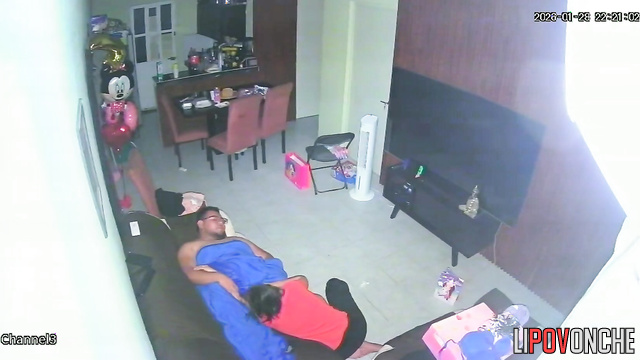 A horny mom plays with her bored husband's big cock while watching TV