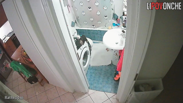 A cute girl with a seductive body strips completely naked in the bathroom