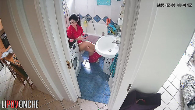 After cleaning, the housewife pulled down her pants and sat on the toilet
