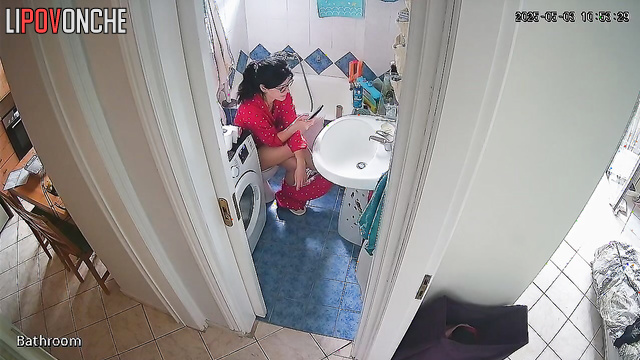 After cleaning, the housewife pulled down her pants and sat on the toilet