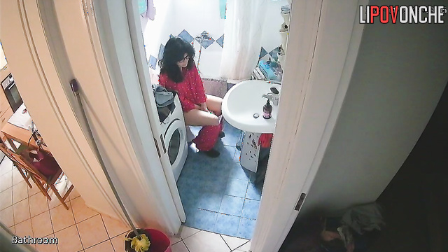 A sleepy cutie slowly pulls down her pajama bottoms, revealing her delicate bottom