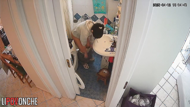 A cute brunette washes her butt, then carefully dries it and her wet pussy