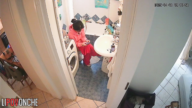 Brunette takes her time putting on her panties after using the restroom