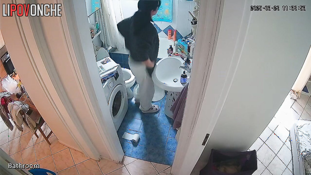 A girl with her bare ass washes her hands without getting up from the toilet