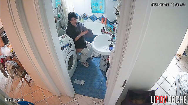 A girl with her bare ass washes her hands without getting up from the toilet