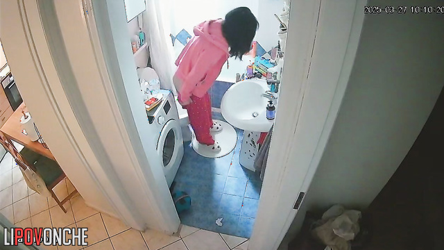 A sleepy girl carefully wipes her wet cunt after peeing in the middle of the night