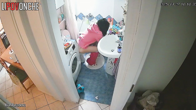 A sleepy girl carefully wipes her wet cunt after peeing in the middle of the night