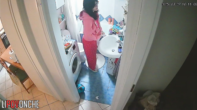 A sleepy girl carefully wipes her wet cunt after peeing in the middle of the night