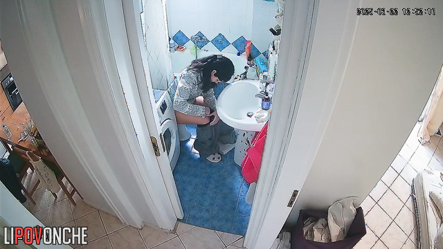 Cutie seductively pulls her pants down over her bottom as she sits down on the toilet