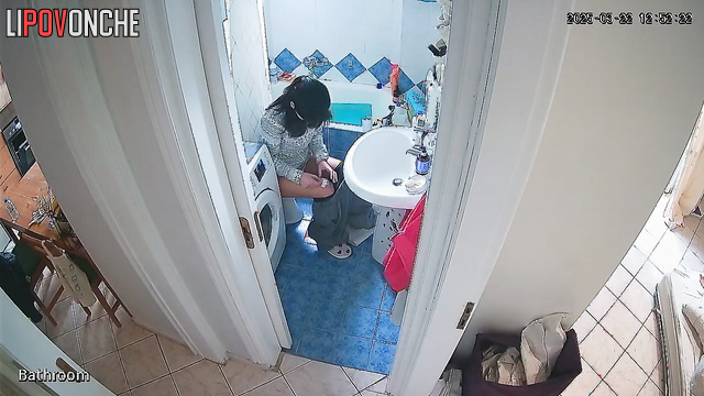 Cutie seductively pulls her pants down over her bottom as she sits down on the toilet