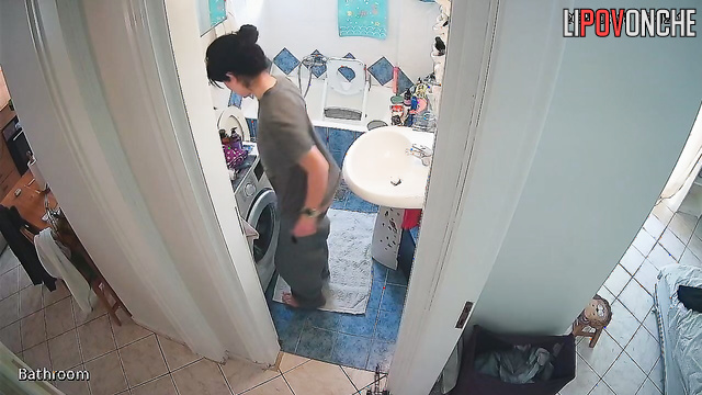 A girl with her naked ass takes off a panty liner from her half-way-down panties