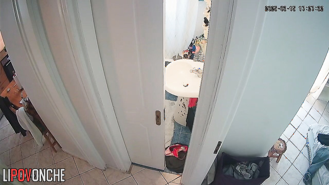 A girl with her naked ass takes off a panty liner from her half-way-down panties