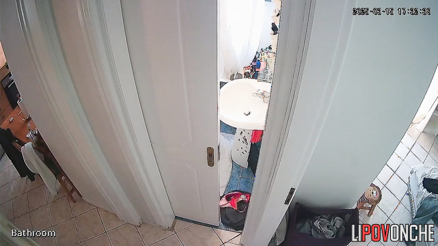 A girl with her naked ass takes off a panty liner from her half-way-down panties