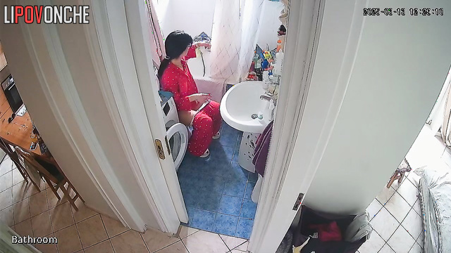 After cleaning the apartment, the girl pulls down her panties and sits down to pee