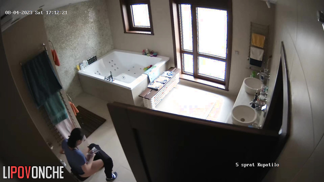 Brunette eagerly pulls down her pants and sits on the toilet with her bare ass