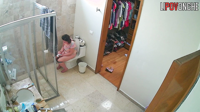 A half-asleep mommy in the toilet takes off and throws away her used panties