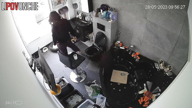 A stunning brunette bares her big butt and sits on a fancy toilet