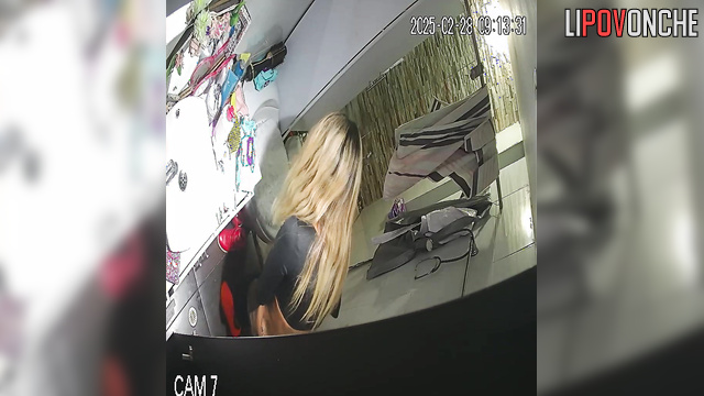 The blonde bares her tattooed butt as she sits down on the toilet