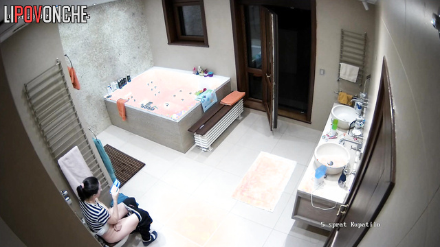 The girl threw the balcony door wide open just before sitting down on the toilet
