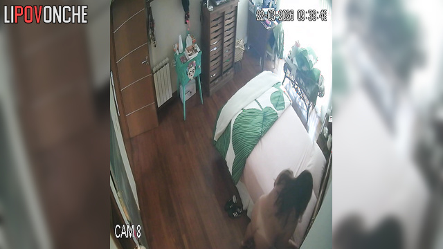 A sexy milf makes her bed, seductively showing off her naked body