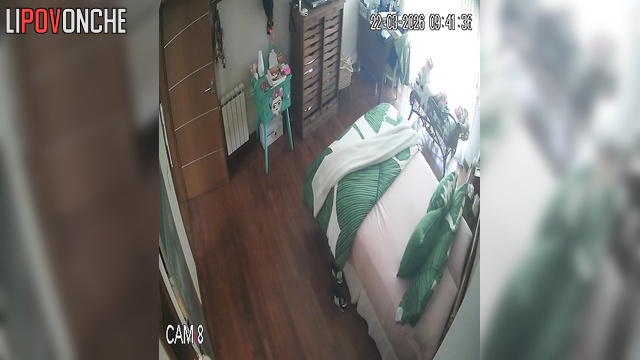 A sexy milf makes her bed, seductively showing off her naked body