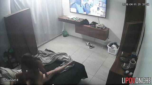 A caring wife generously coats her husband's large, erect cock with oil