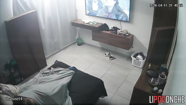 A caring wife generously coats her husband's large, erect cock with oil