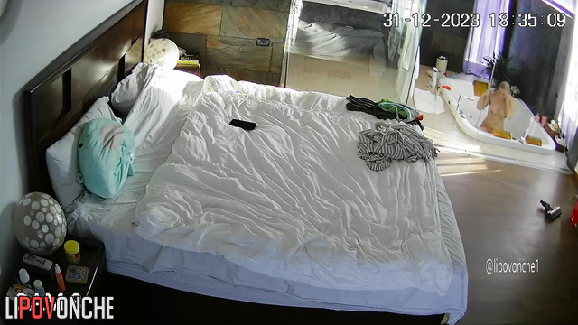 Busty naked blonde doing her morning routine (huge bedroom)