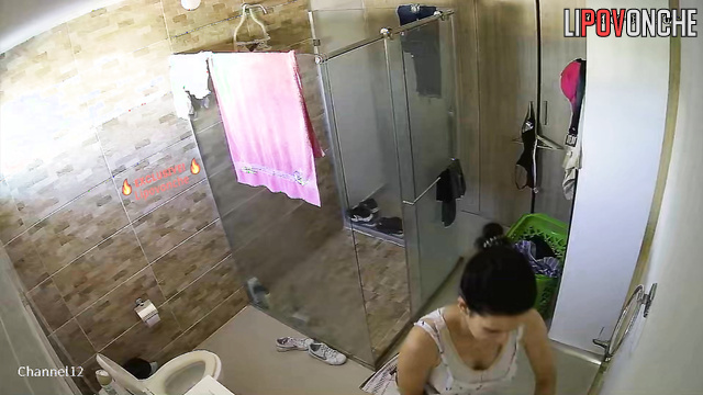 Brunette with hot body dressing to the gym after bathing