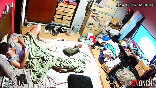 Busty brunette is bored on the bed (hidden camera)