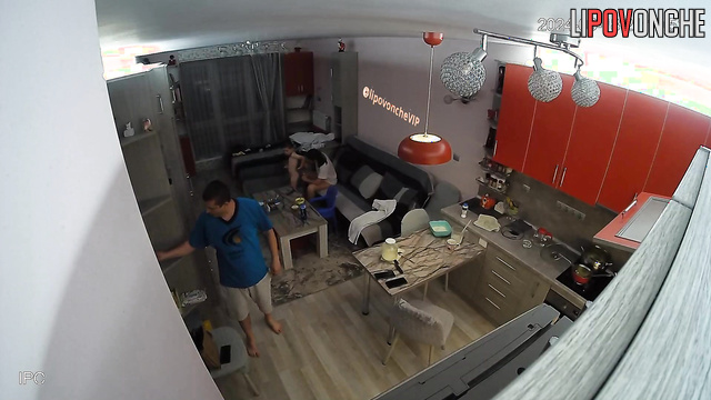 Family preparing for a meal in their huge kitchen