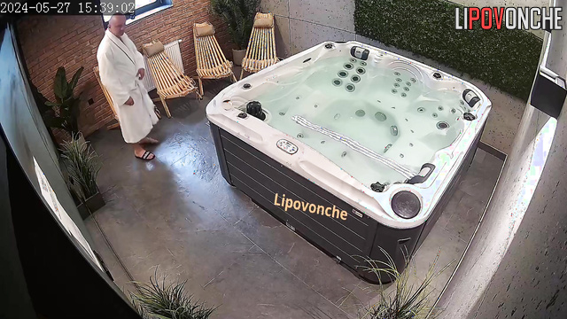 The couple took off their robes and began relaxing in the jacuzzi naked